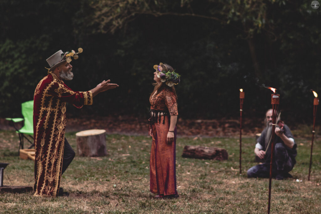 Oberon gesturing at Titania. They might be in the middle of a fight.